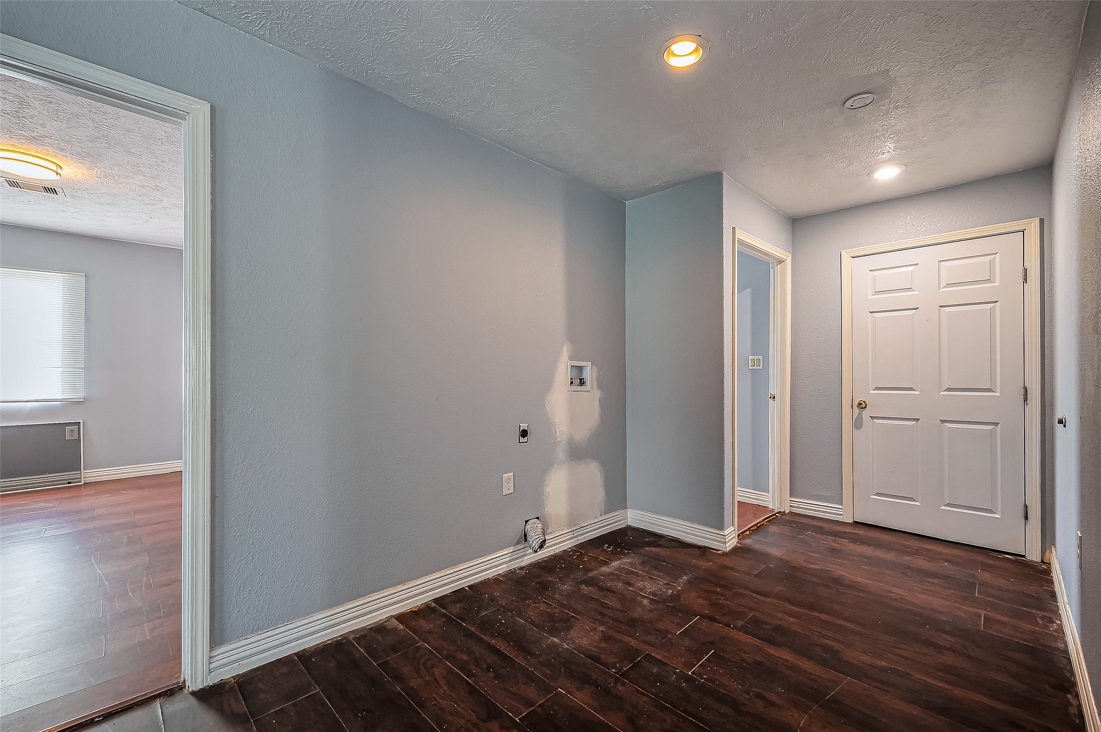 710 East Sycamore Street Fresno, TX 77545 - Photo 14 of 32 a view of an empty room and wooden floor
