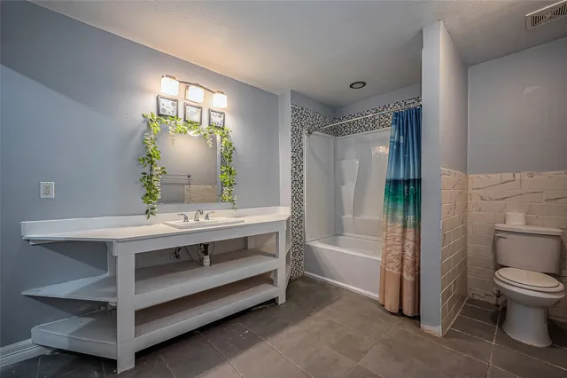 a view of bathroom with a sink toilet and shower
