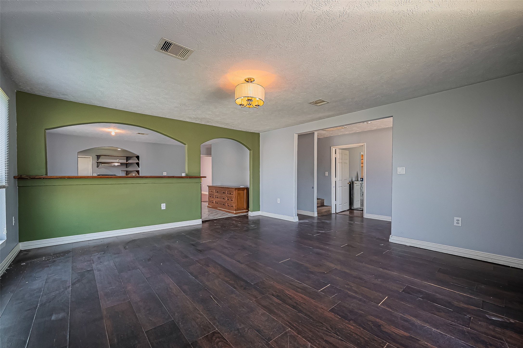 710 East Sycamore Street Fresno, TX 77545 - Photo 8 of 32 a view of empty room with wooden floor and fan
