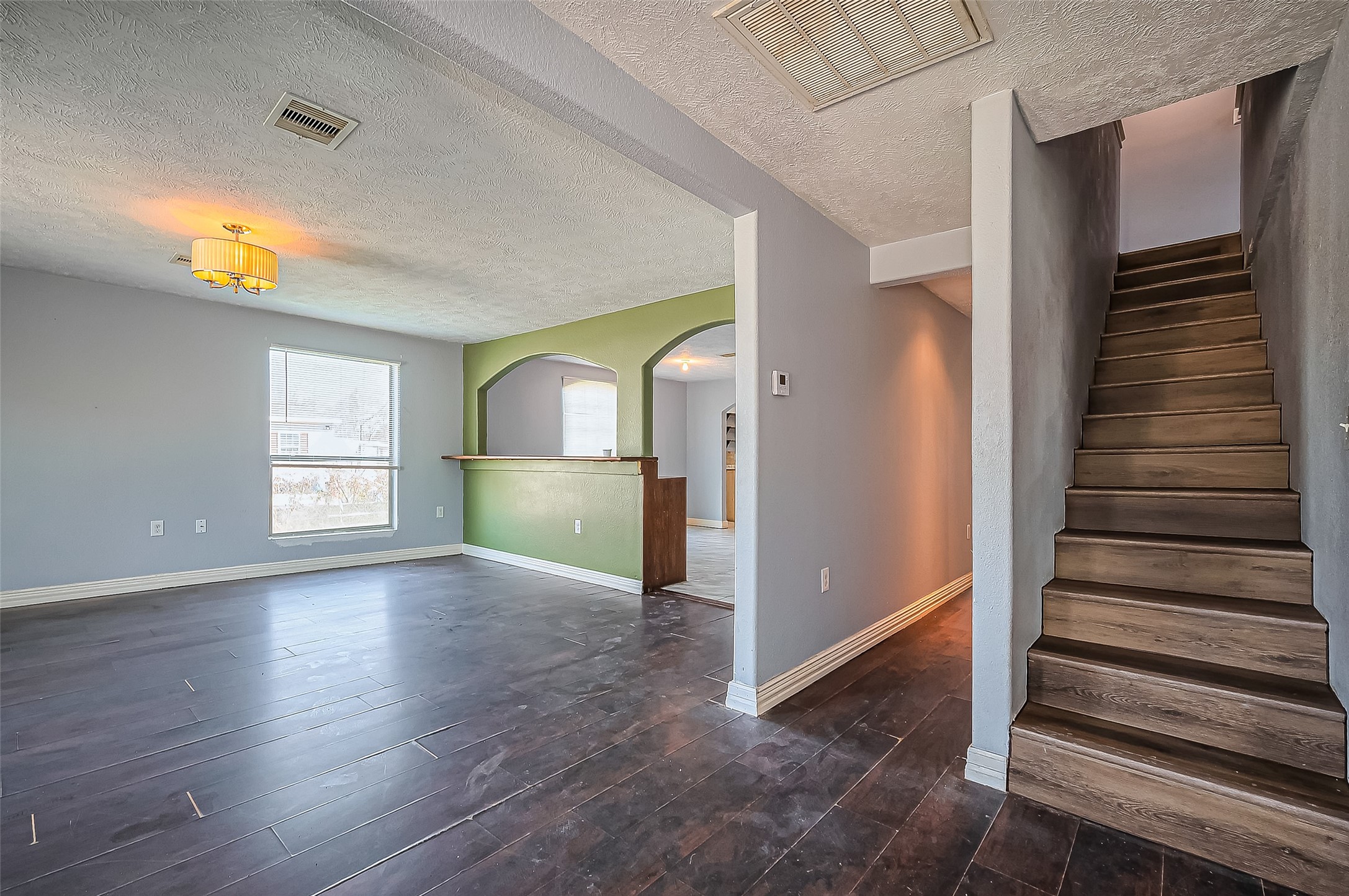 710 East Sycamore Street Fresno, TX 77545 - Photo 9 of 32 wooden floor in an empty room with a window