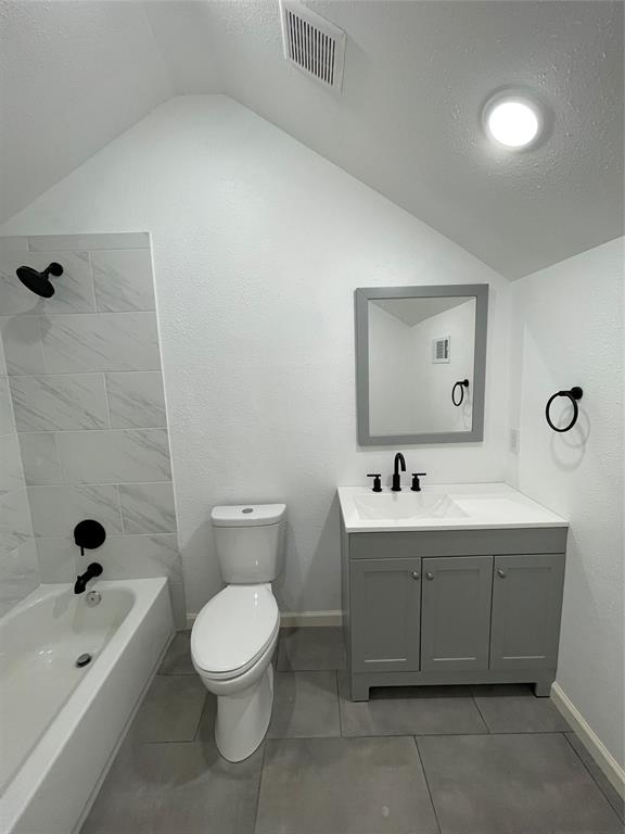 607 East Monterey Street Denison, TX 75021 - Photo 22 of 34 a bathroom with a toilet a sink and mirror