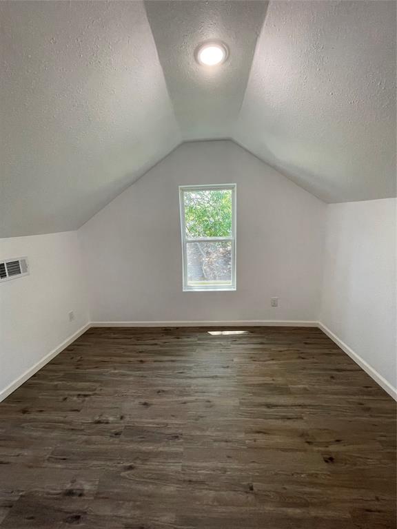 607 East Monterey Street Denison, TX 75021 - Photo 25 of 34 an empty room with wooden floor and windows