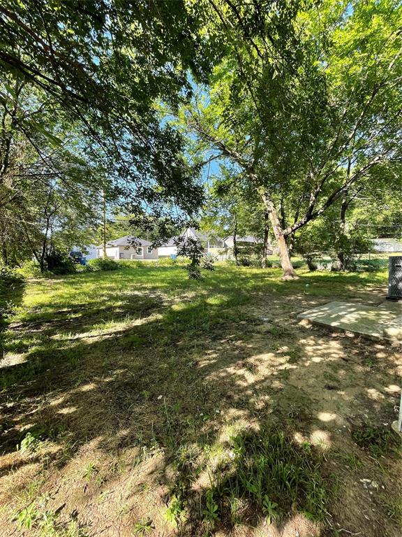 607 East Monterey Street Denison, TX 75021 - Photo 30 of 34 a big yard with trees
