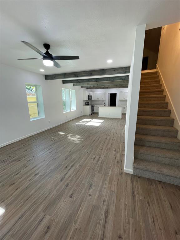 607 East Monterey Street Denison, TX 75021 - Photo 3 of 34 a view of a livingroom with wooden floor and staircase