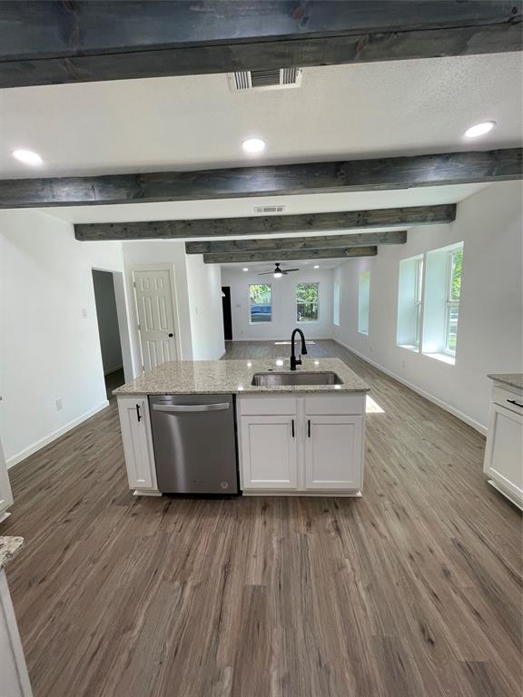 607 East Monterey Street Denison, TX 75021 - Photo 8 of 34 a room with wooden floor and chair