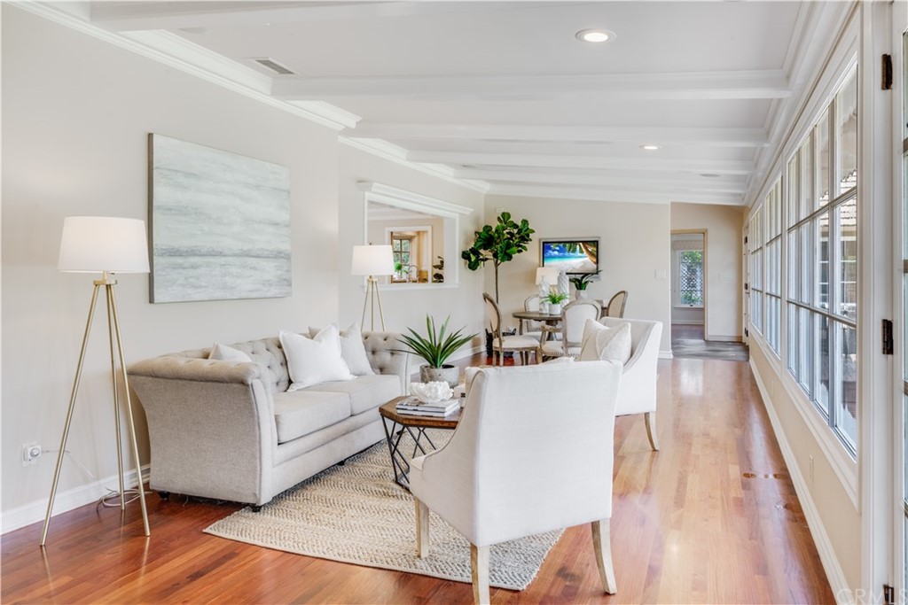 4255 Chestnut Avenue Long Beach, CA 90807 - Photo 13 of 48 a living room with furniture and a wooden floor