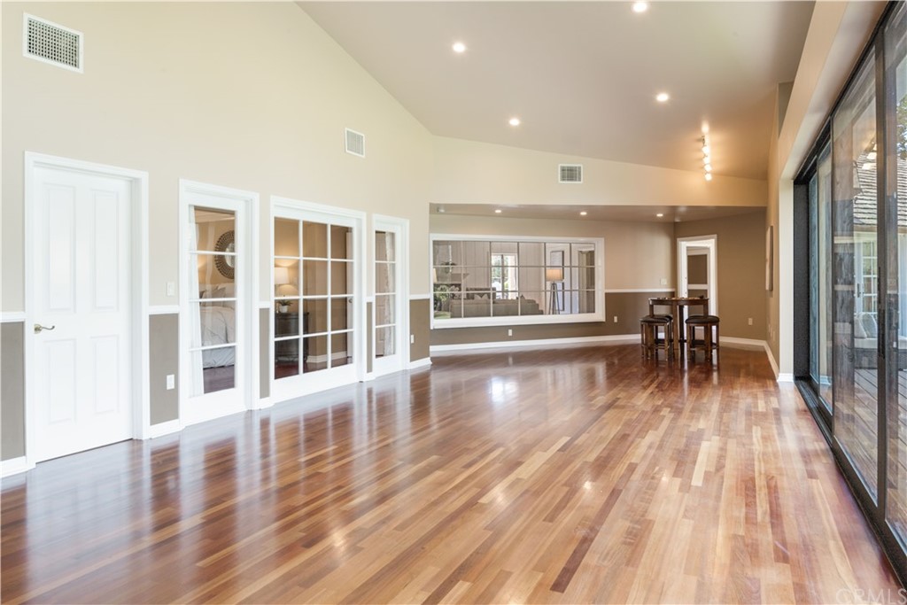4255 Chestnut Avenue Long Beach, CA 90807 - Photo 17 of 48 a view of a living room and dining room with wooden floor