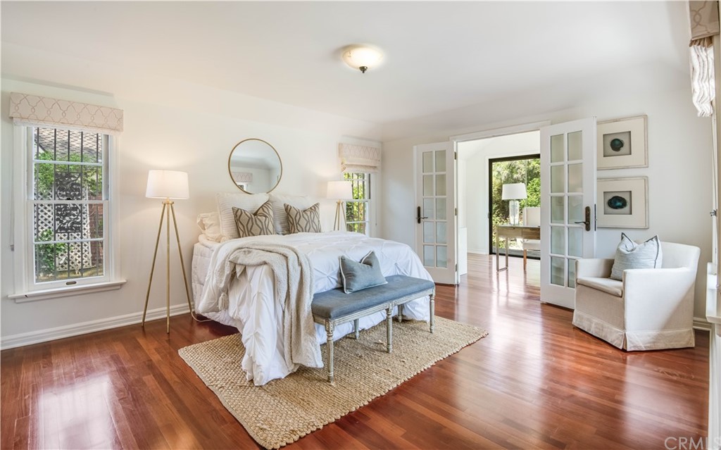 4255 Chestnut Avenue Long Beach, CA 90807 - Photo 21 of 48 a bed room with furniture and a wooden floor