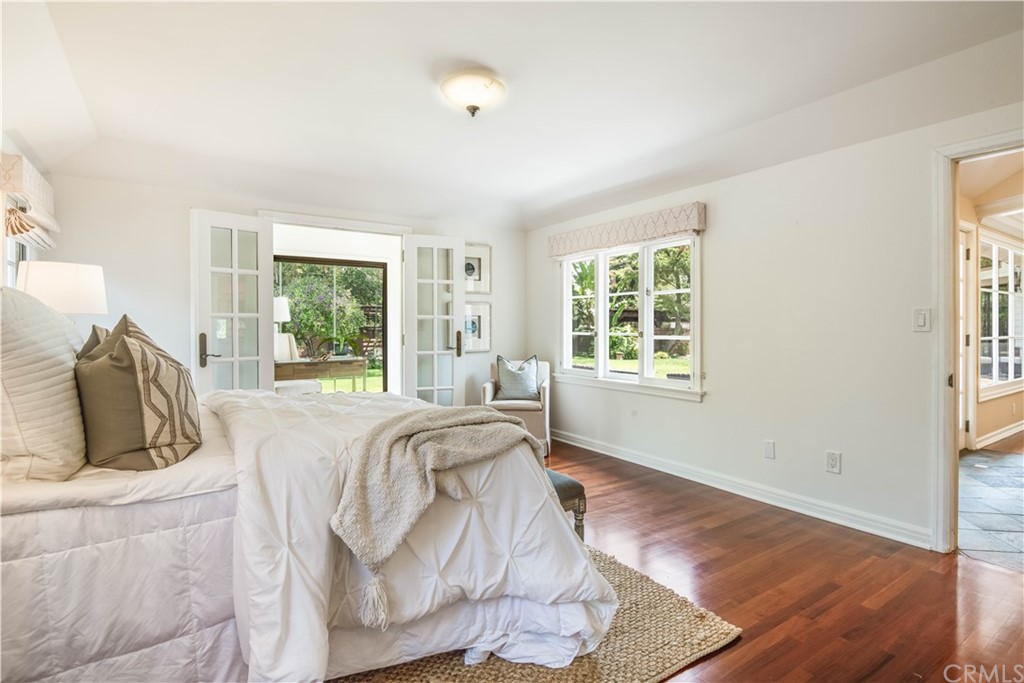 4255 Chestnut Avenue Long Beach, CA 90807 - Photo 22 of 48 a bed sitting in a bedroom next to a window