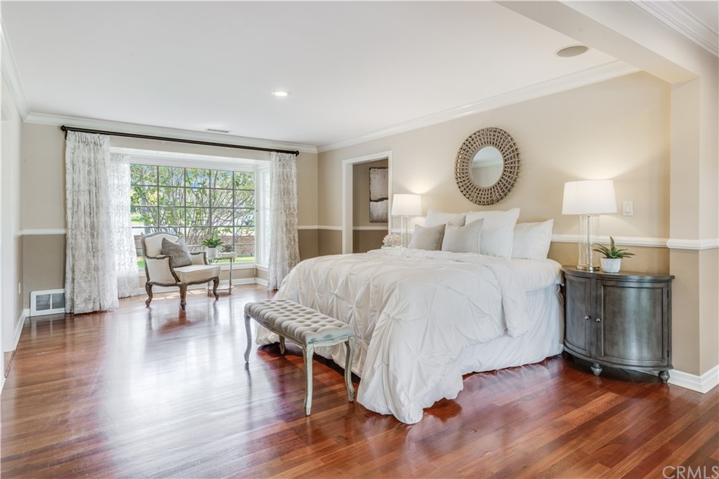 4255 Chestnut Avenue Long Beach, CA 90807 - Photo 27 of 48 a bedroom with a large bed and a large window