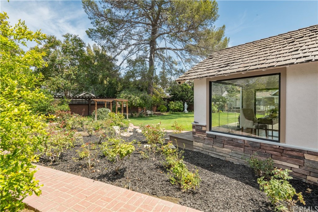 4255 Chestnut Avenue Long Beach, CA 90807 - Photo 36 of 48 a view of a house with backyard and sitting area