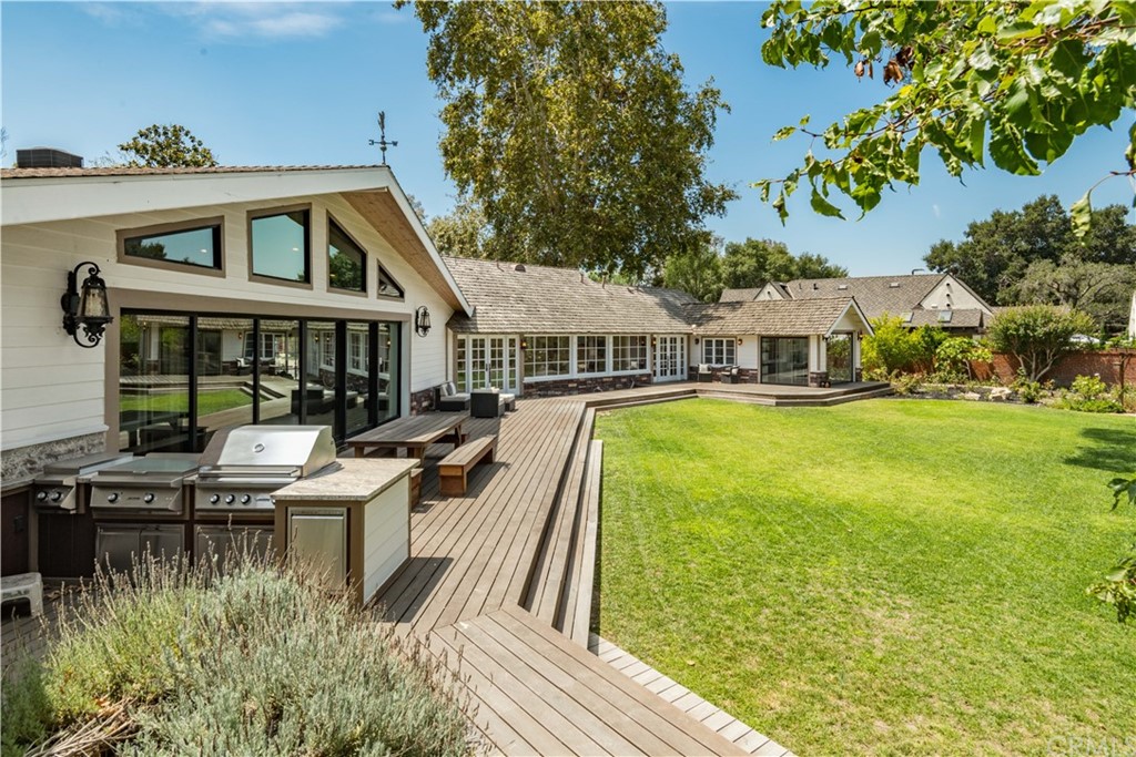 4255 Chestnut Avenue Long Beach, CA 90807 - Photo 40 of 48 a view of a house with pool and chairs