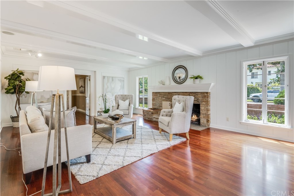 4255 Chestnut Avenue Long Beach, CA 90807 - Photo 6 of 48 a living room with fireplace furniture and a large window