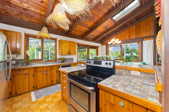 a kitchen that has a sink and a stove