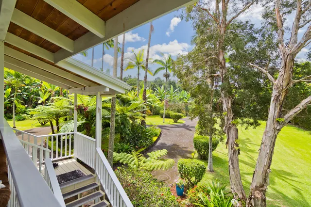 a view of balcony with wooden floor