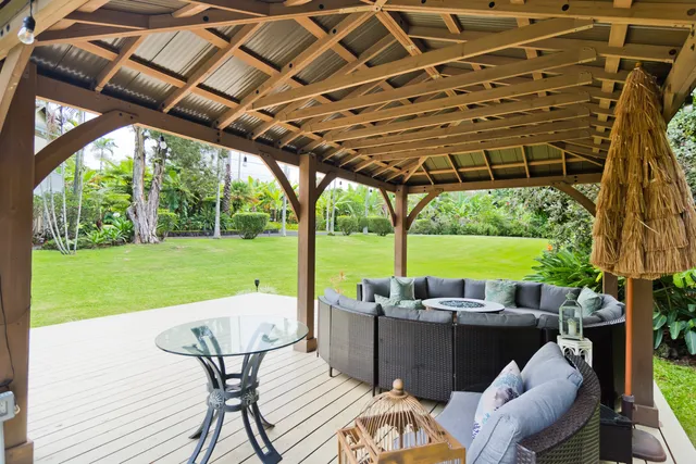 a view of a patio with couches chairs dining table and chairs