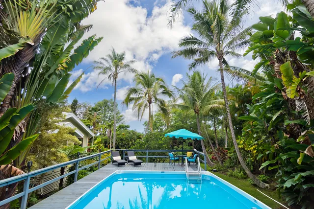 a view of swimming pool with chairs