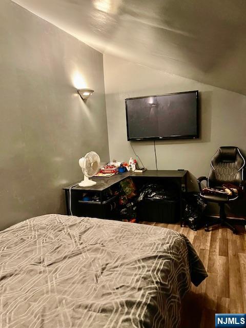 539 Union Avenue, Unit 11 Irvington, NJ 07111 - Photo 11 of 12 a bedroom with a bed and a flat screen tv