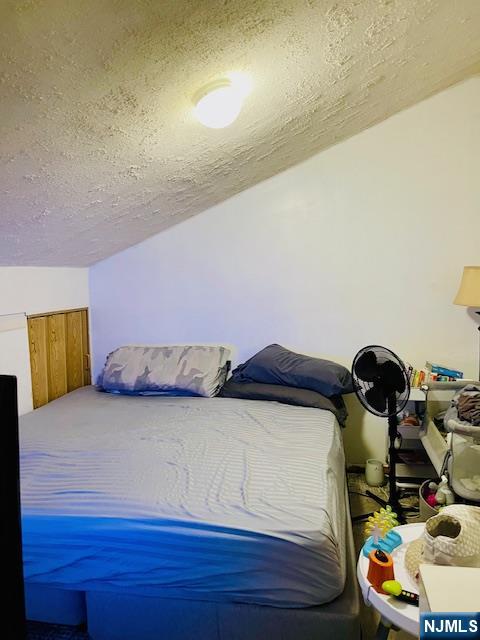 539 Union Avenue, Unit 11 Irvington, NJ 07111 - Photo 12 of 12 a bedroom with a bed and a dresser