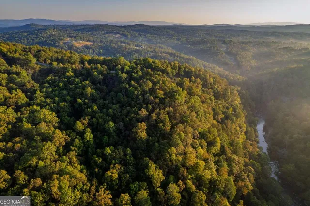 a view of mountain with sunset