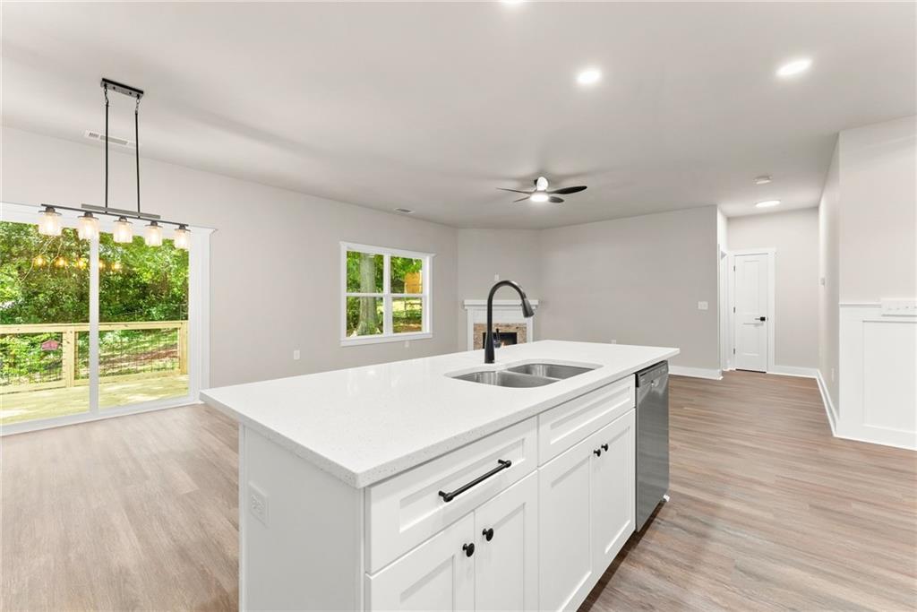 43 Anderson Street Jefferson, GA 30549 - Photo 10 of 45 a kitchen with a sink and chandelier