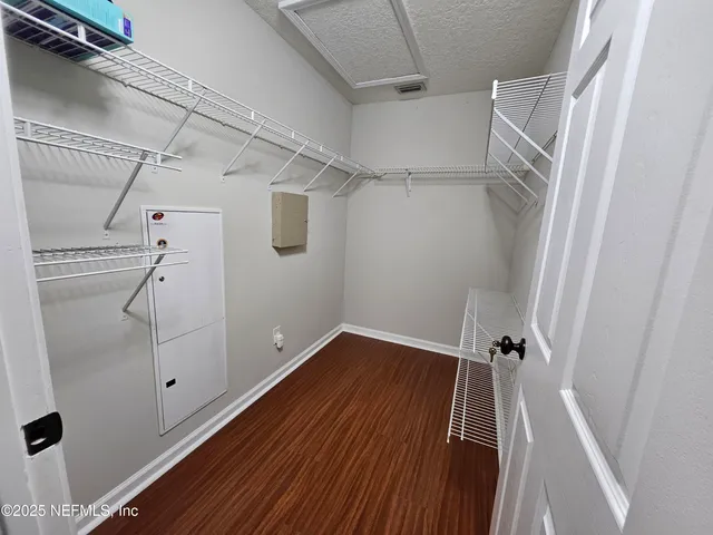 a view of a room with racks on the wall