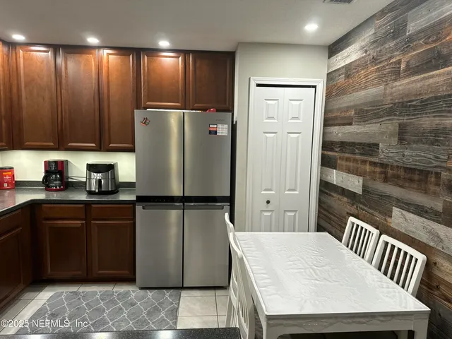 a white refrigerator freezer sitting in a kitchen