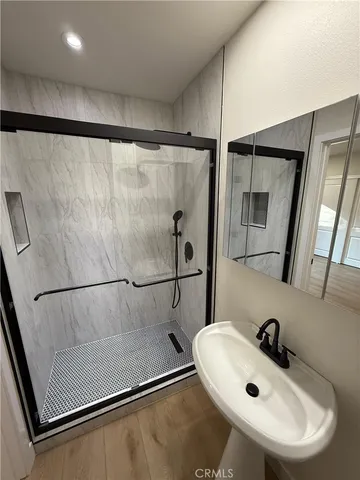 a bathroom with a sink and mirror