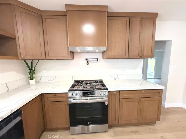 a kitchen with cabinets and appliances