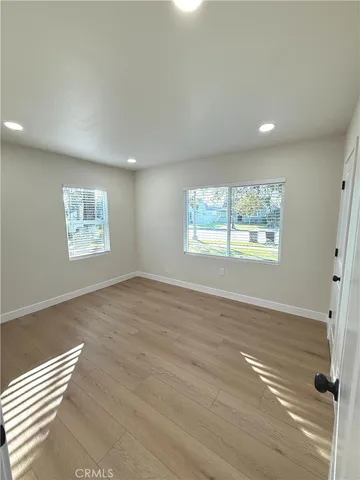a view of an empty room and a window