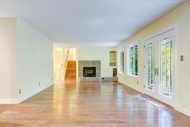 a kitchen with stainless steel appliances granite countertop a refrigerator and a cabinets