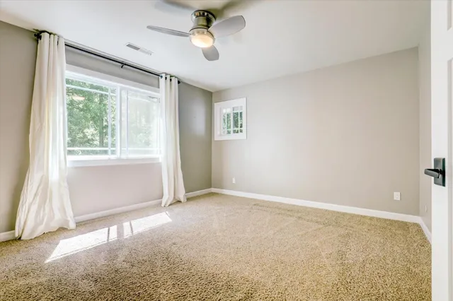 a view of a house with backyard and wooden floor