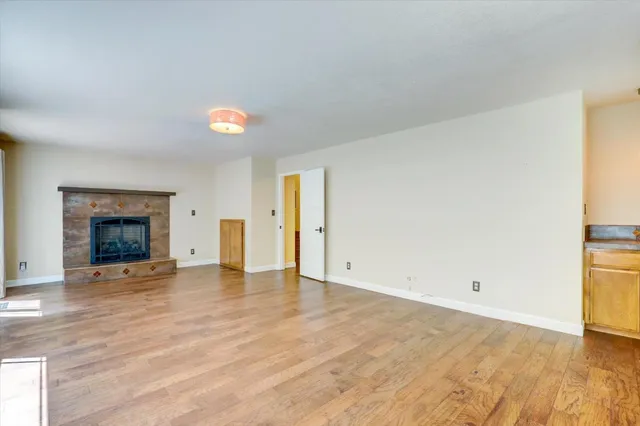a view of a yard with wooden fence
