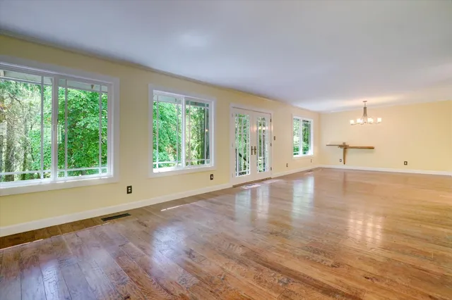 a view of a dining room with furniture window and outside view