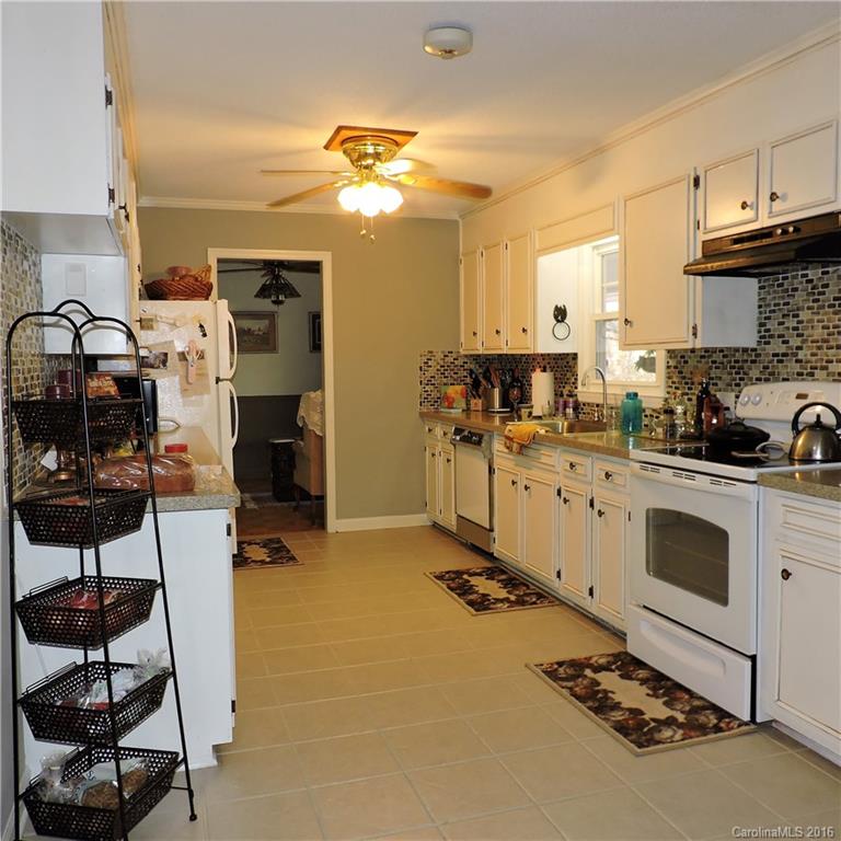 848 South Potter Road Lancaster, SC 29720 - Photo 11 of 24 a room with a washing machine and cabinets