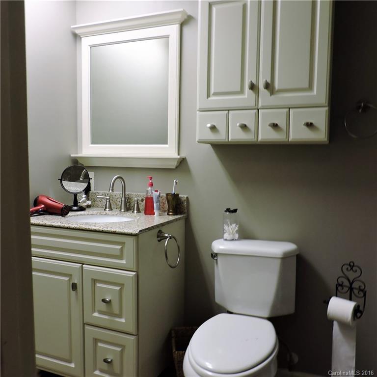 848 South Potter Road Lancaster, SC 29720 - Photo 13 of 24 a bathroom with a granite countertop toilet sink and mirror