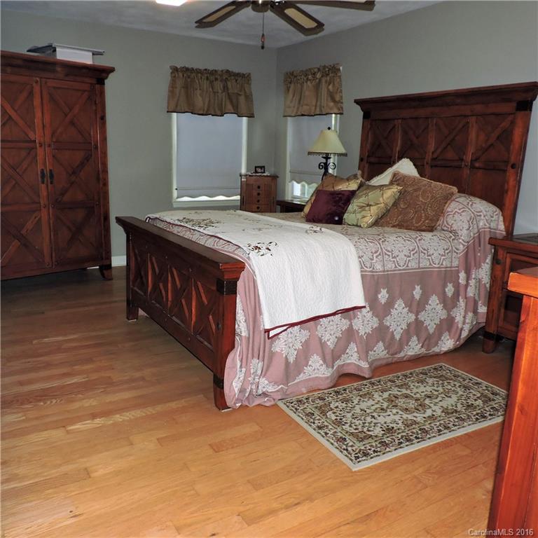 848 South Potter Road Lancaster, SC 29720 - Photo 14 of 24 a bedroom with a bed and a walk in closet