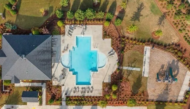 an aerial view of houses with outdoor space