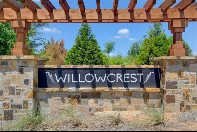 a street sign on a wall next to road