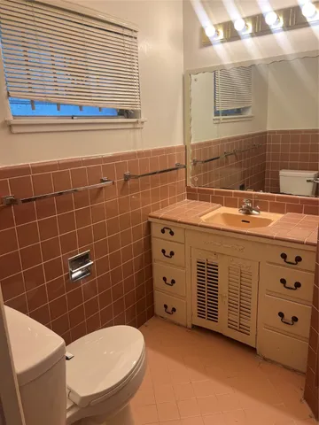 a close view of a sink and a mirror in a bathroom