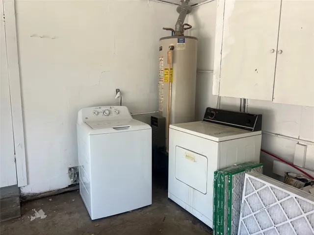 a view of backyard with tub and trees