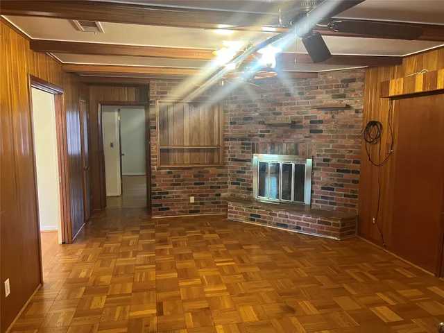 a kitchen with refrigerator and window