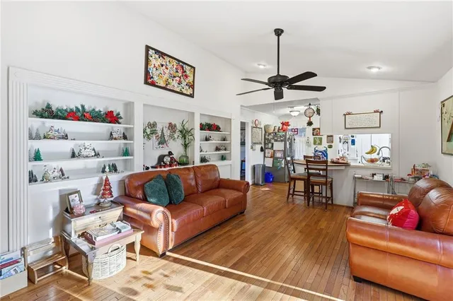 a view of an entryway with wooden floor