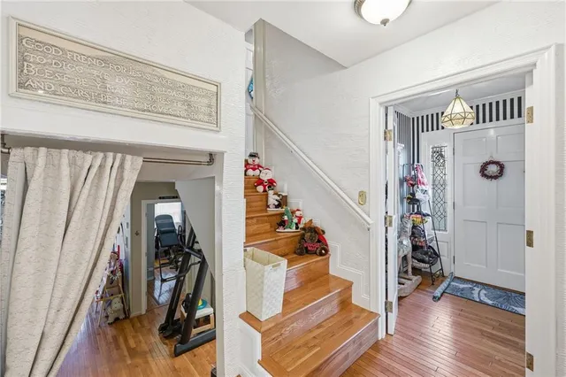 a bathroom with a sink vanity mirror and toilet