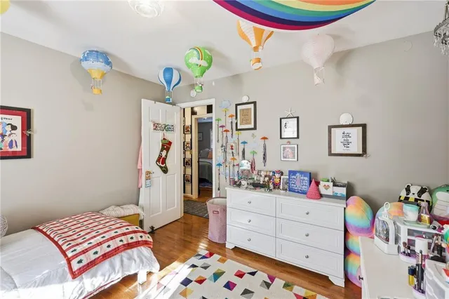 a bed room with a bed and a television