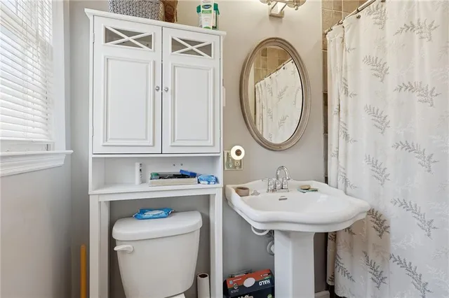 a living room with furniture gym equipment and a window