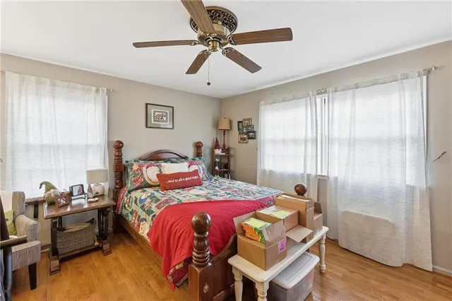 a bathroom with a sink a toilet and a window
