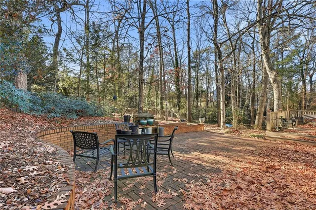 a view of a backyard with sitting area and furniture