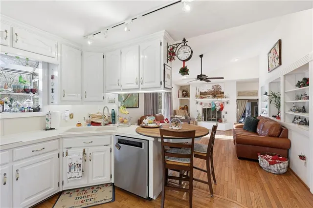 a view of a livingroom with furniture and hardwood floor