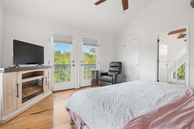 a view of a deck with wooden floor and outdoor seating